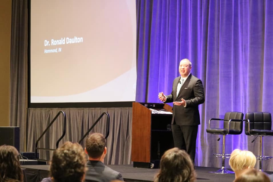 Dr. Daulton presenting at a seminar about herniated disc treatment